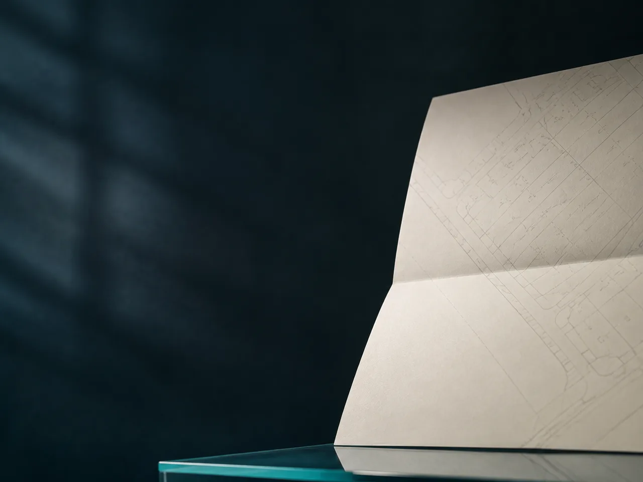 A folded architectural plan representing the premises and lease document